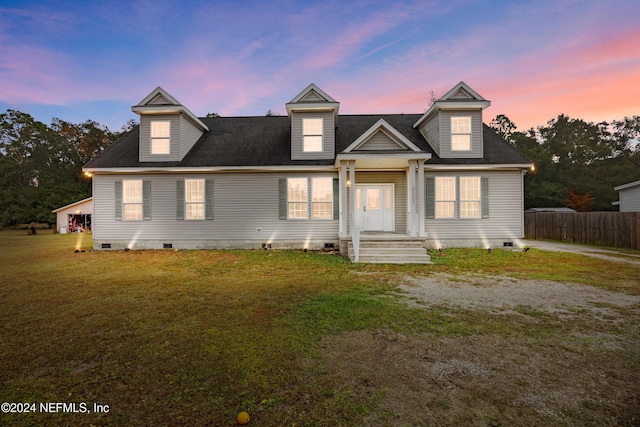 new england style home with a yard