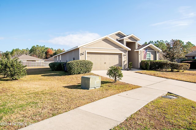 view of front facade featuring a garage and a front yard