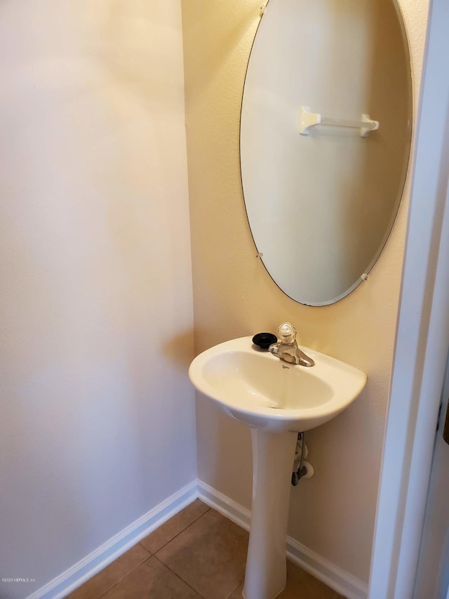 bathroom with tile patterned flooring