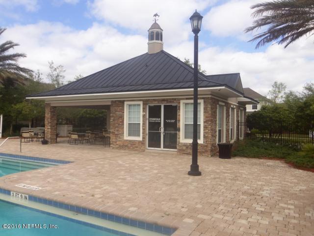 back of house featuring a patio and a community pool