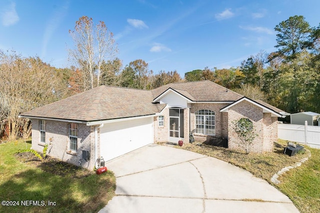 ranch-style house featuring a garage