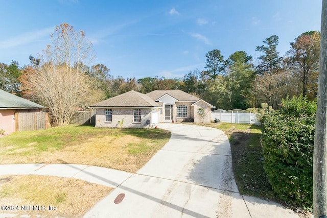 single story home with a front yard