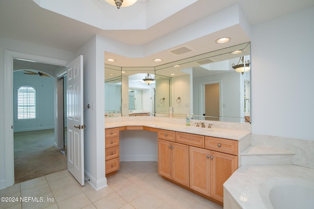 bathroom featuring vanity, a bathtub, tile patterned floors, and ceiling fan