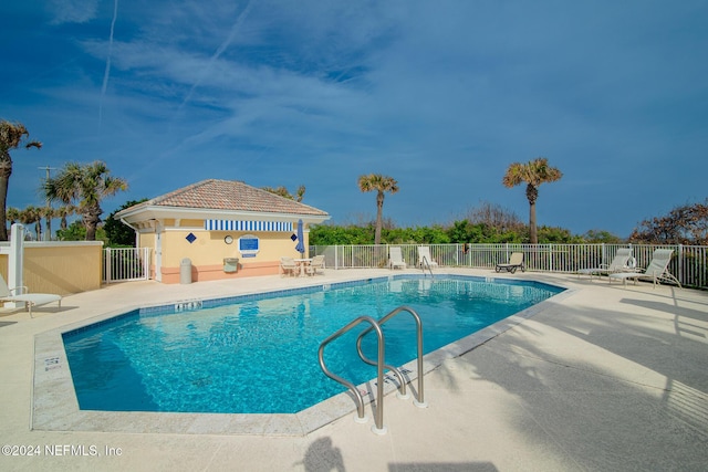 view of pool featuring a patio area