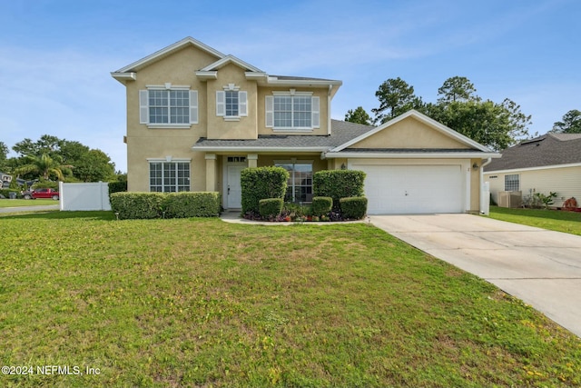 view of front facade with a front lawn and a garage