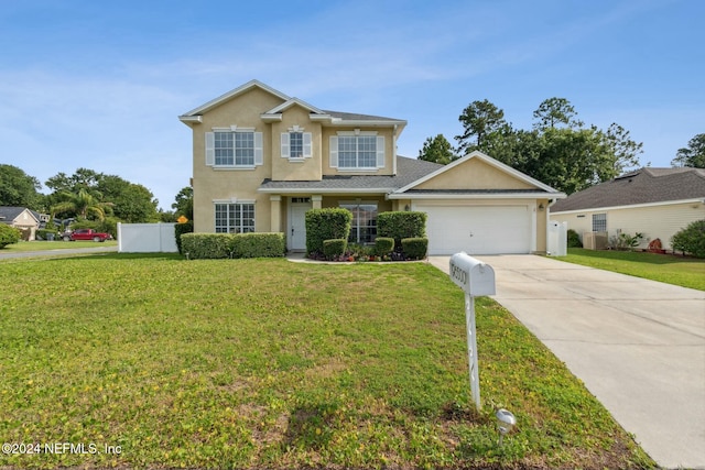 view of front of house with a front lawn and a garage