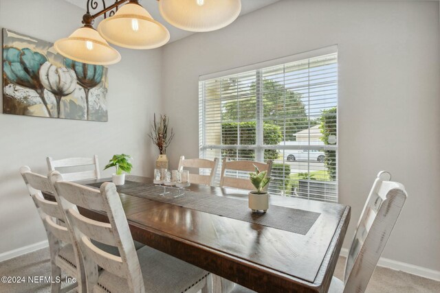 dining space with carpet floors