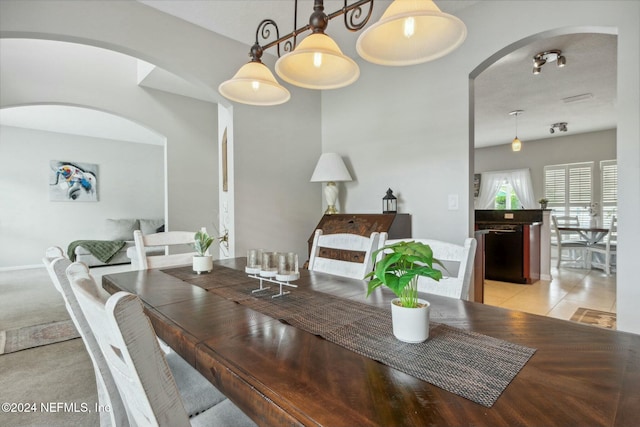 dining area with light tile patterned floors