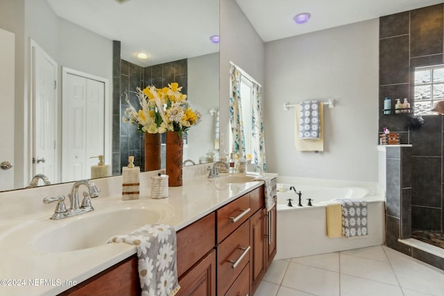 bathroom with tile patterned flooring, vanity, and shower with separate bathtub