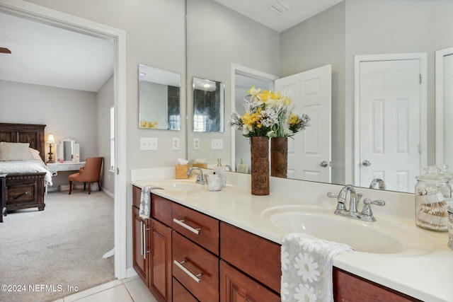 bathroom featuring tile patterned flooring and vanity