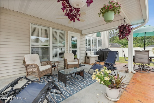 view of patio featuring an outdoor hangout area, area for grilling, ceiling fan, and a wooden deck