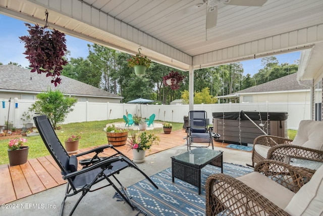 view of patio with ceiling fan, an outdoor hangout area, a wooden deck, and a hot tub