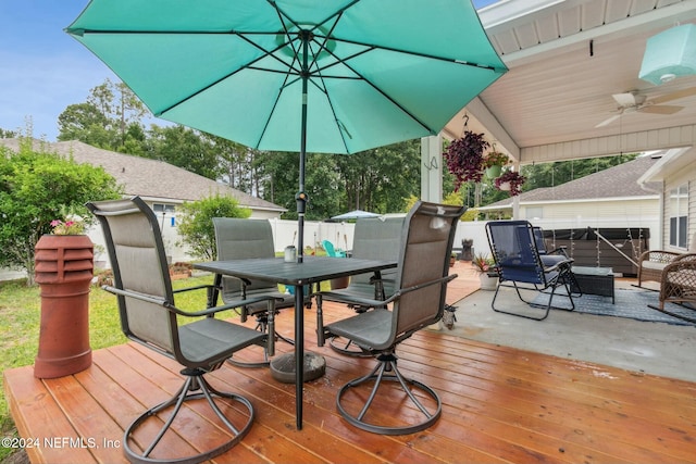 wooden deck with ceiling fan