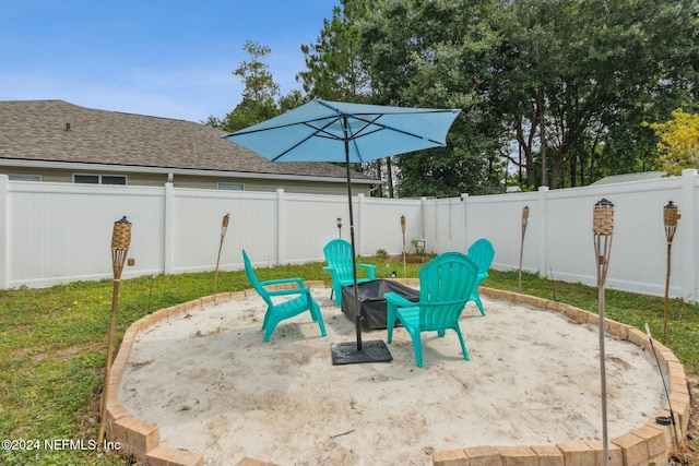 view of patio with a fire pit