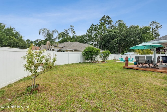 view of yard featuring a wooden deck