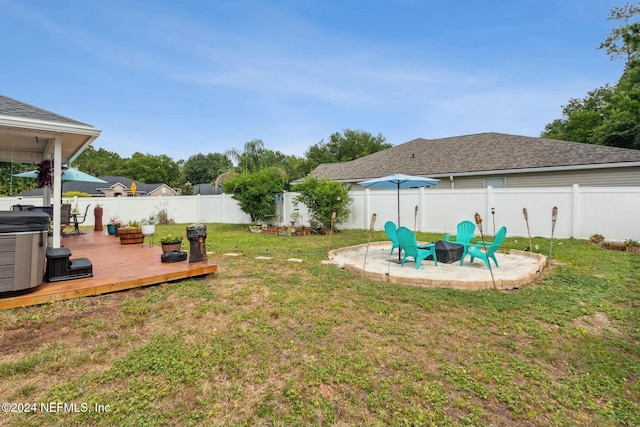 view of yard with an outdoor fire pit and a wooden deck