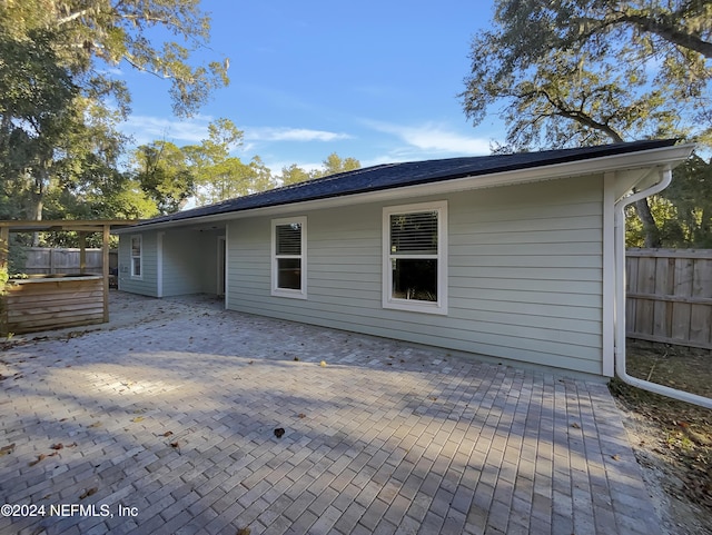 back of house with a patio