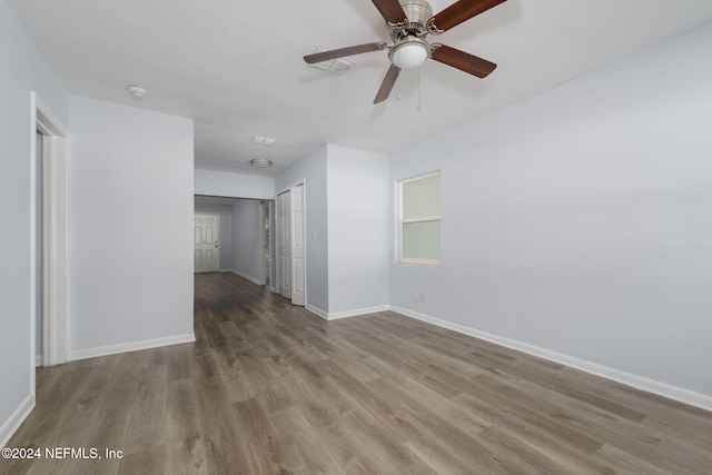 spare room with light hardwood / wood-style flooring and ceiling fan