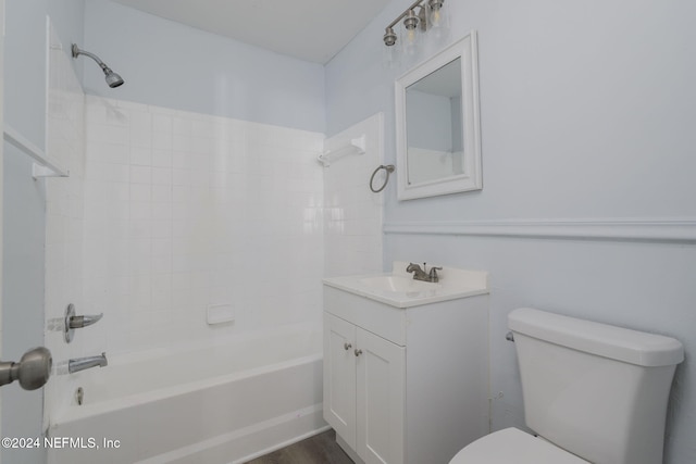 full bathroom with vanity, wood-type flooring, tiled shower / bath combo, and toilet