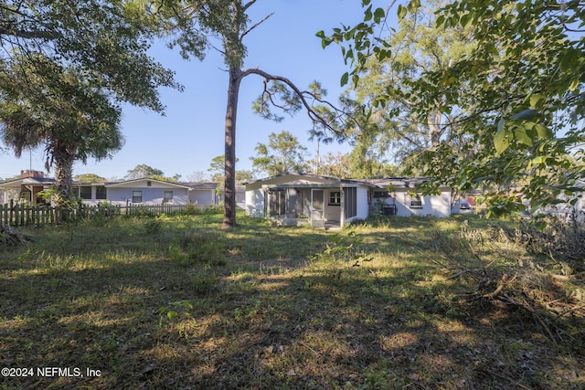 view of yard with a sunroom