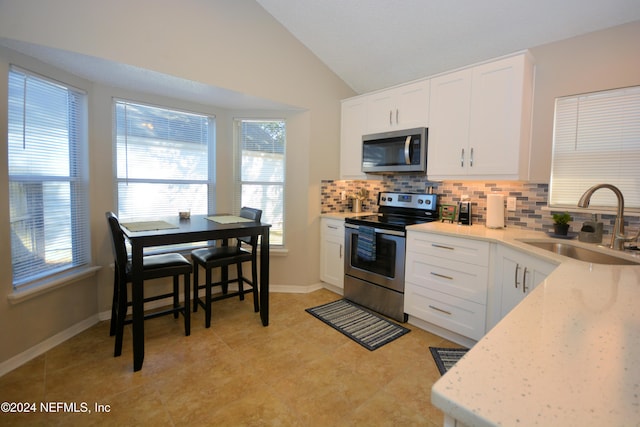 kitchen with white cabinets, stainless steel appliances, and sink