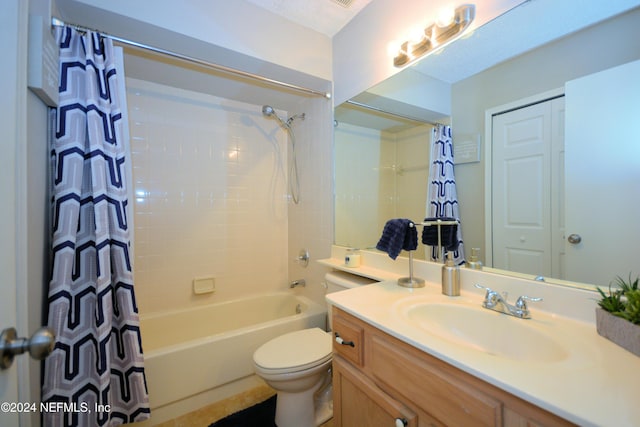 full bathroom featuring vanity, shower / tub combo, and toilet