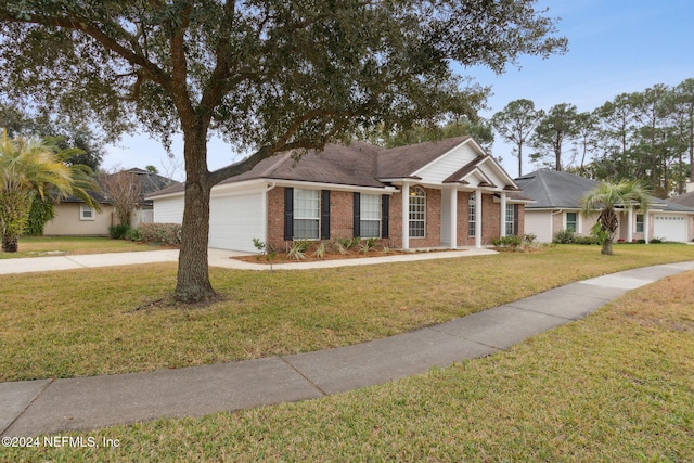 single story home featuring a garage and a front lawn