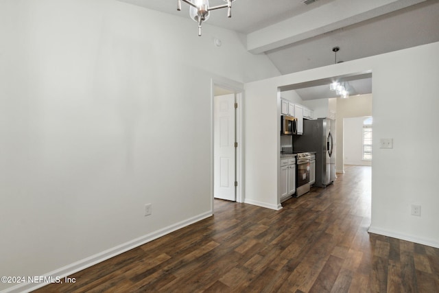 interior space featuring lofted ceiling with beams and dark wood-type flooring