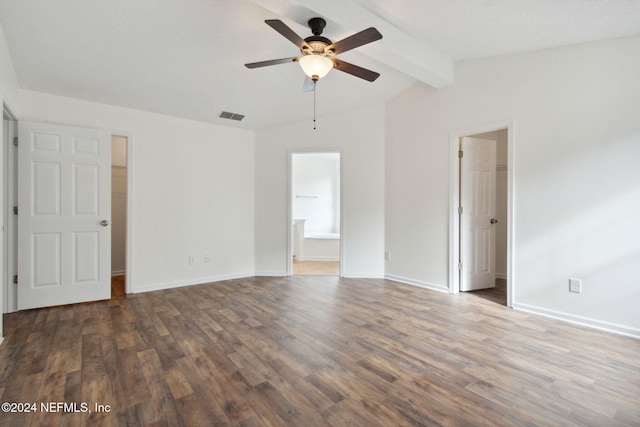 empty room featuring dark hardwood / wood-style floors, lofted ceiling with beams, and ceiling fan