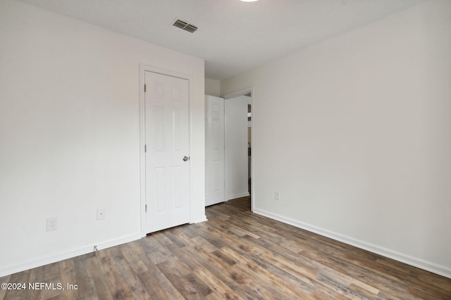 empty room featuring dark hardwood / wood-style floors