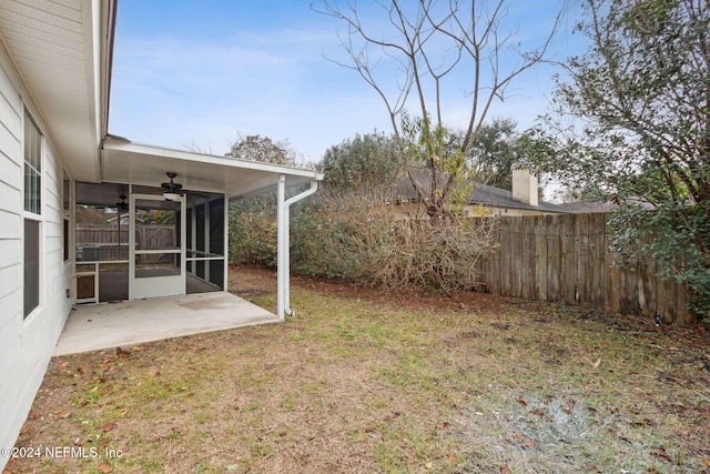 view of yard featuring a patio area and a sunroom