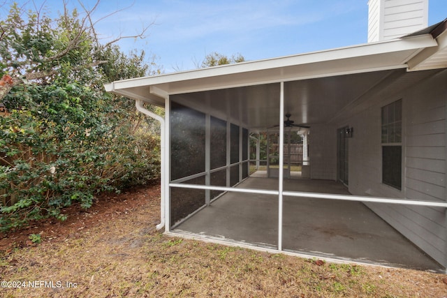 exterior space with a sunroom and ceiling fan