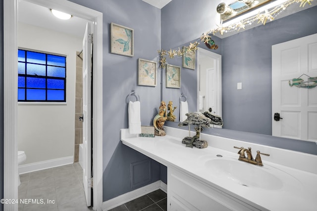 bathroom featuring tile patterned flooring, a shower with curtain, vanity, and toilet