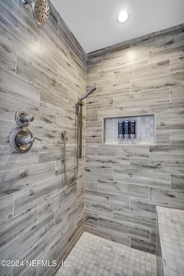 bathroom with a tile shower