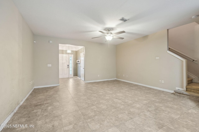 unfurnished living room with ceiling fan and light tile patterned flooring