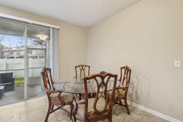 dining area featuring light tile patterned floors