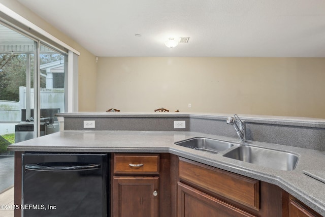 kitchen featuring sink and black dishwasher