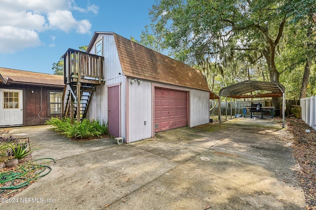 garage featuring a carport