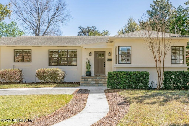 view of front of house featuring stucco siding