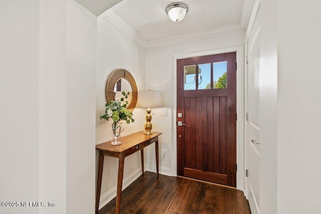 foyer entrance with dark wood-style floors, baseboards, ornamental molding, and a textured ceiling