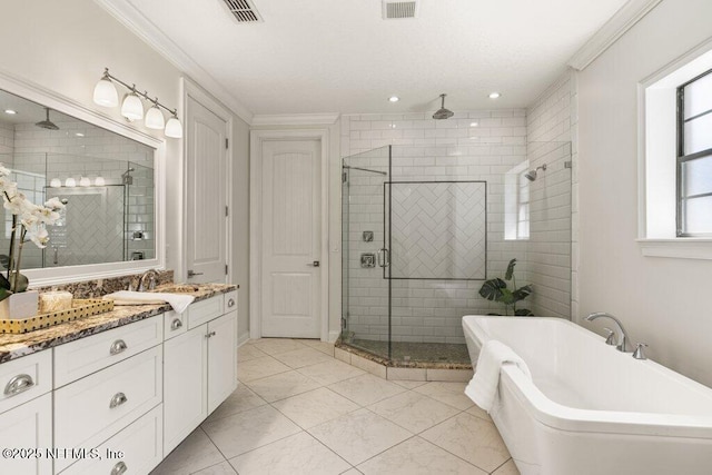 full bath with ornamental molding, a stall shower, and visible vents