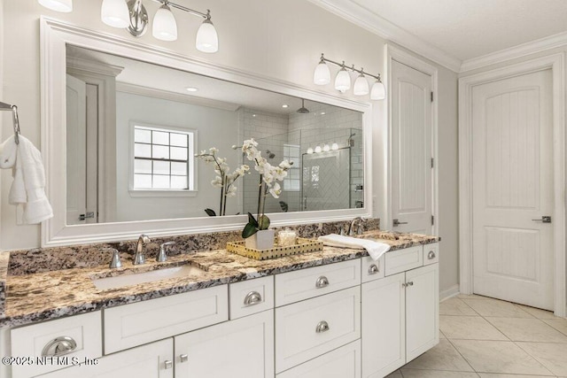 full bath with double vanity, crown molding, a sink, and a shower stall