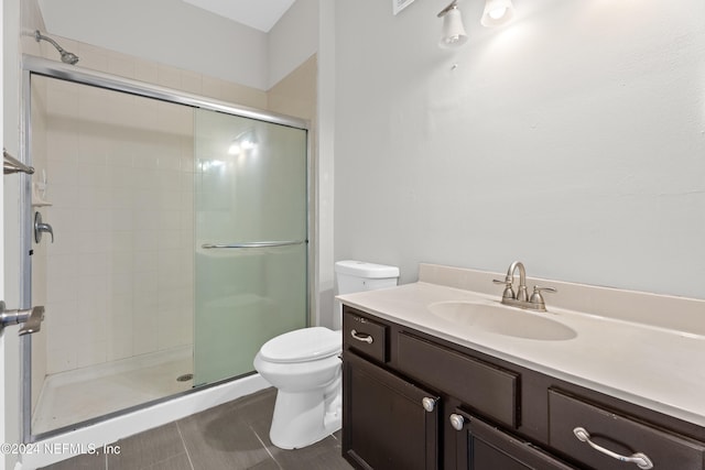 8601 Beach Blvd Unit 1007, Jacksonville, FL 32216 - full bathroom with a stall shower, vanity, and tile patterned flooring