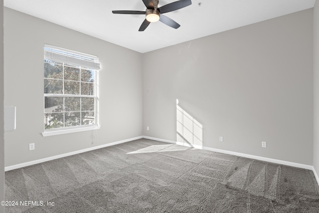 8601 Beach Blvd Unit 1007, Jacksonville, FL 32216 - unfurnished room featuring ceiling fan, carpet, and plenty of natural light