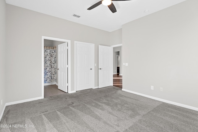 8601 Beach Blvd Unit 1007, Jacksonville, FL 32216 - unfurnished bedroom with carpet flooring, connected bathroom, and ceiling fan