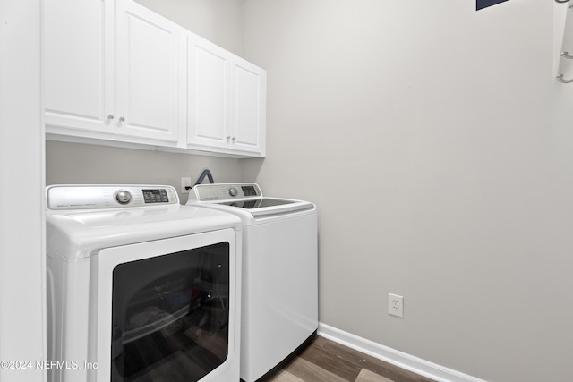 8601 Beach Blvd Unit 1007, Jacksonville, FL 32216 - washroom with independent washer and dryer, cabinet space, and wood finished floors
