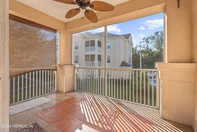 8601 Beach Blvd Unit 1007, Jacksonville, FL 32216 - unfurnished sunroom featuring a ceiling fan