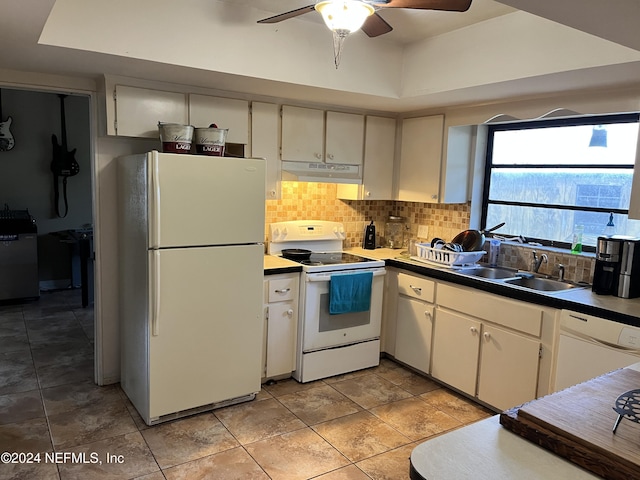 kitchen featuring white cabinets, white appliances, backsplash, and sink