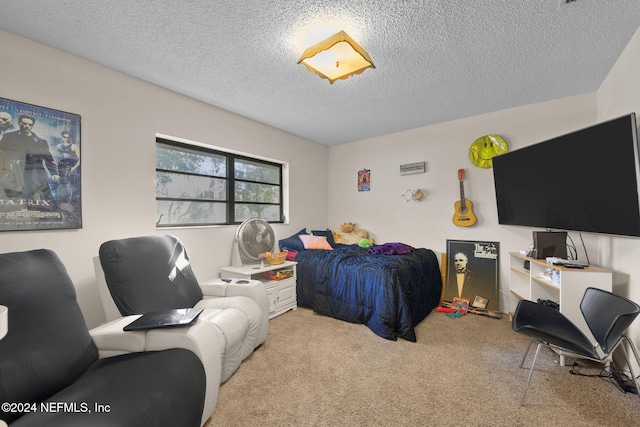 carpeted bedroom with a textured ceiling