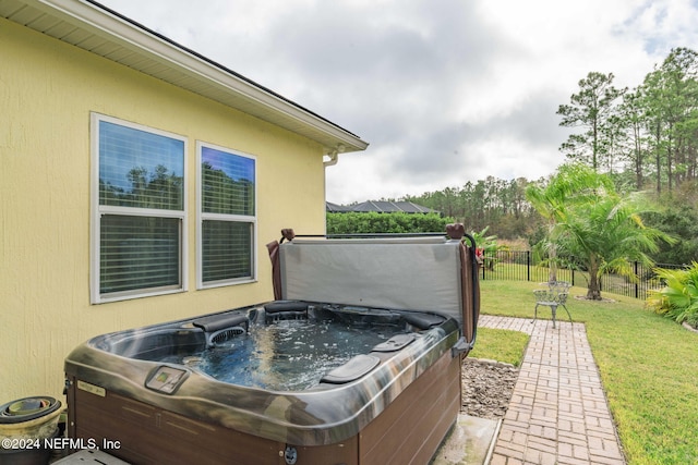 view of patio with a hot tub